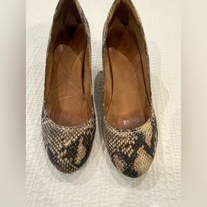 Brown black, wedge, round toe shoes, with a 4 inch heel in a size 12